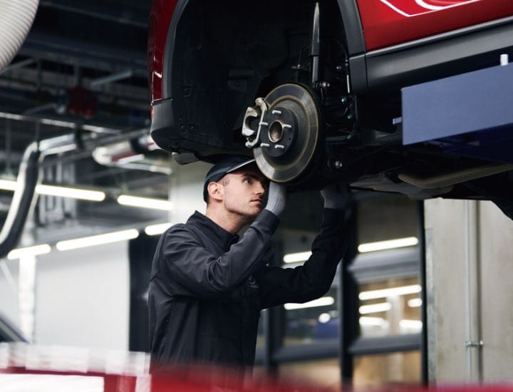 Technician pouring Oil